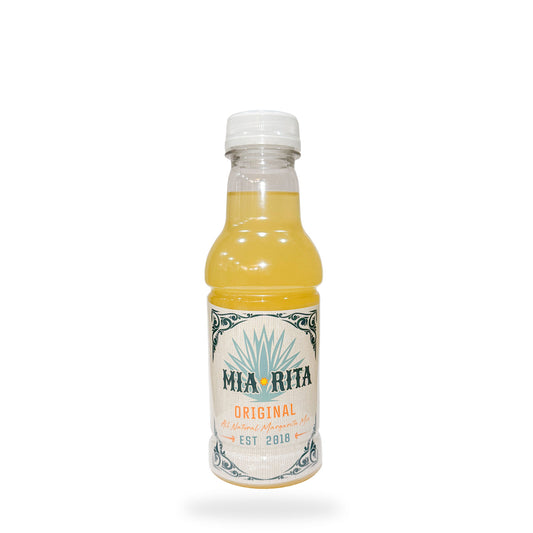 Mia Rita bottle with yellow liquid on a white background
